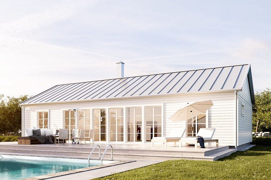 Vitt ladhus med ljusgrått plåttak Gotland