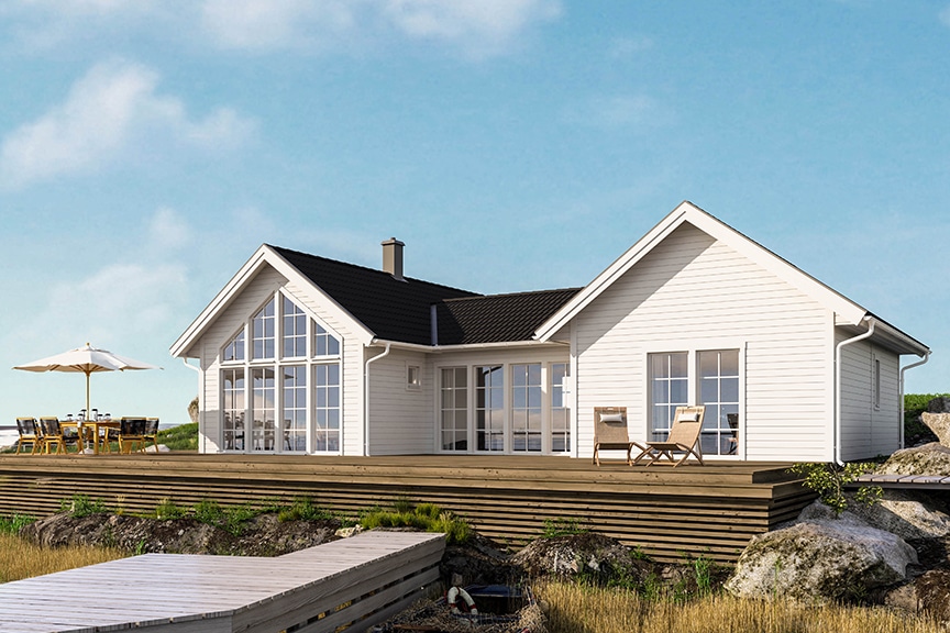 Vitt h-hus med svart tak vid strand Torekov 107